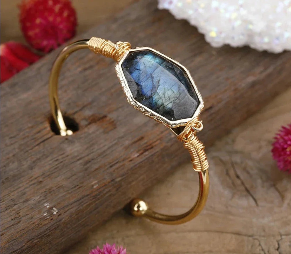 Open bangle cuff bracelet set with a large octagonal labradorite stone showing blue and green flash — product photo 5