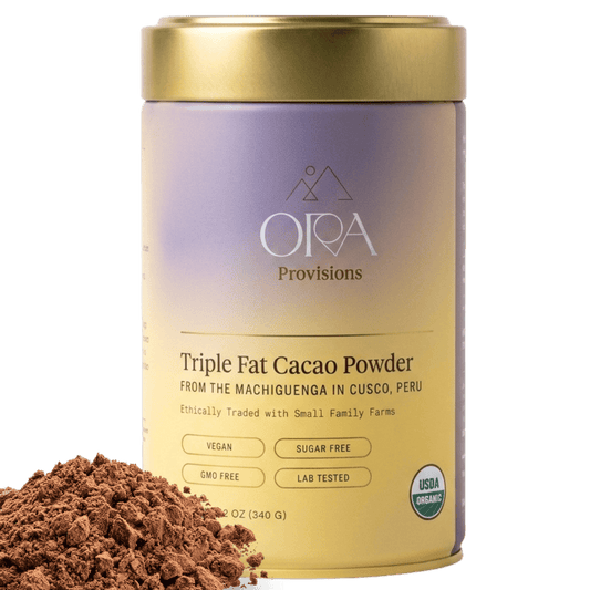 Ora Cacao Triple Fat cacao powder tin shown on a plain neutral background.