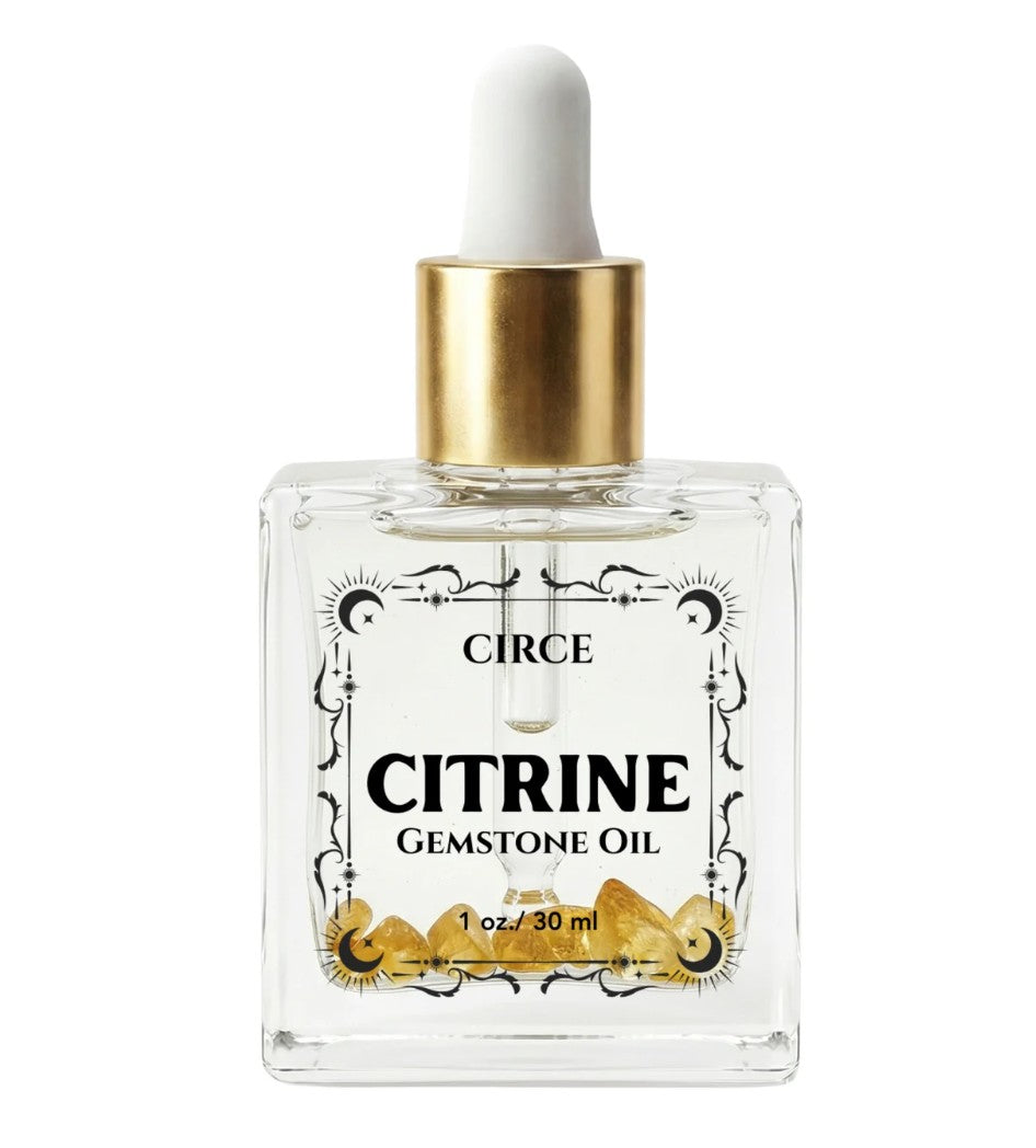 Citrine gemstone shimmer body oil in an apothecary glass bottle with citrine crystals (view 7)