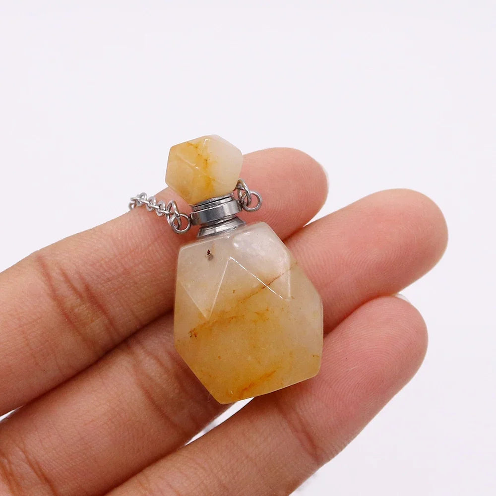 Small glass potion bottle pendant filled with crystals on a stainless steel chain — view 6 of 12