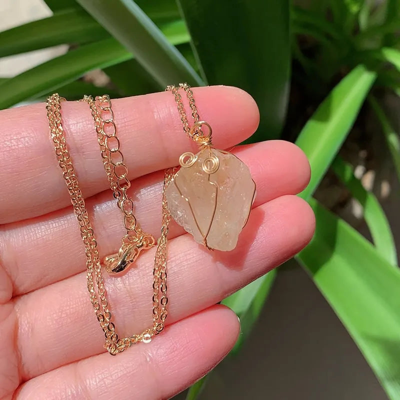 Raw wire-wrapped crystal pendant on a gold-plated stainless steel link chain — view 16 of 20