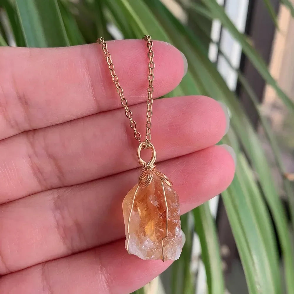 Raw wire-wrapped crystal pendant on a gold-plated stainless steel link chain — view 2 of 20