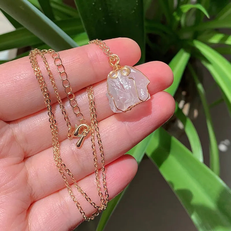Raw wire-wrapped crystal pendant on a gold-plated stainless steel link chain — view 17 of 20