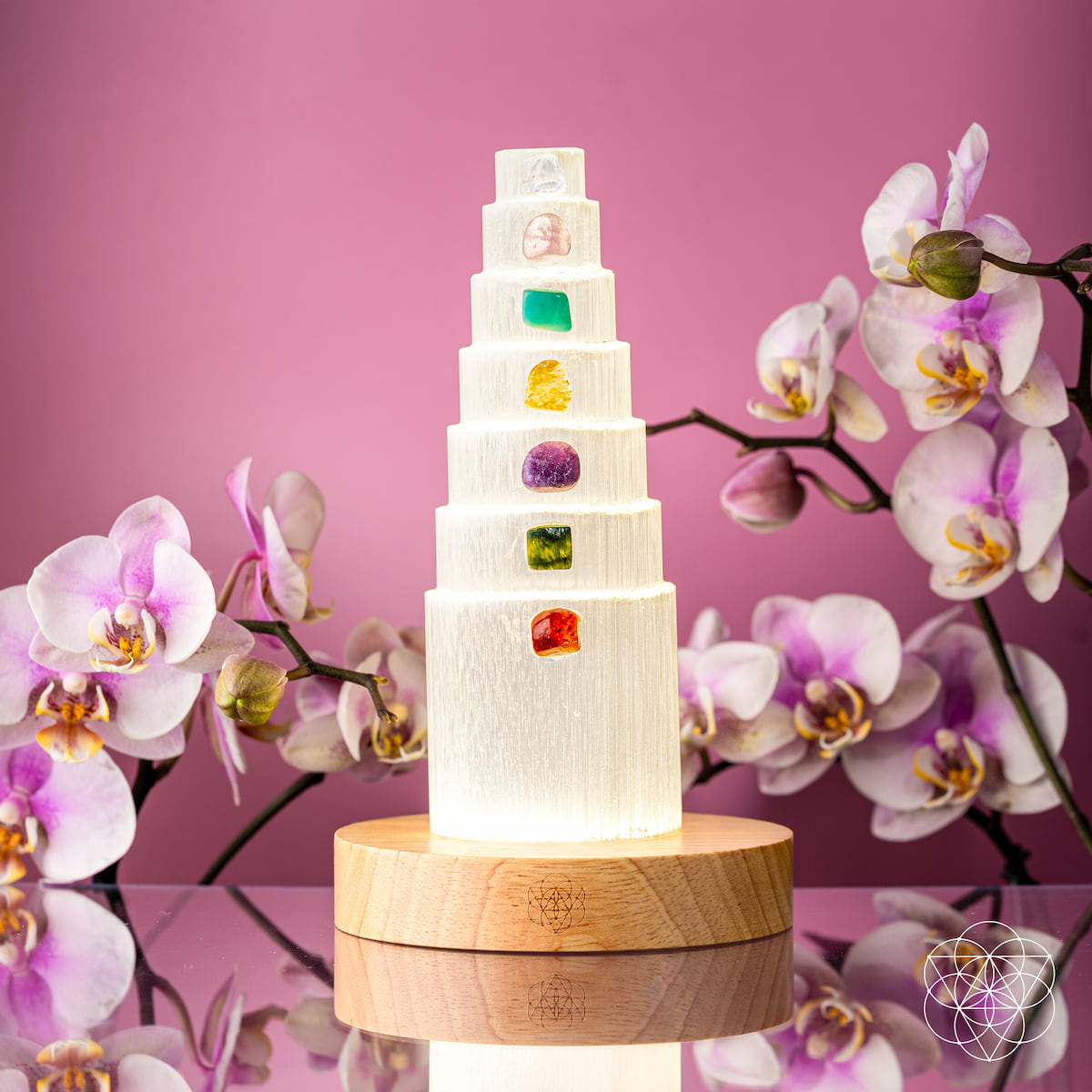 Crystal lamp with seven different colored stones glowing on a wooden base — view 4