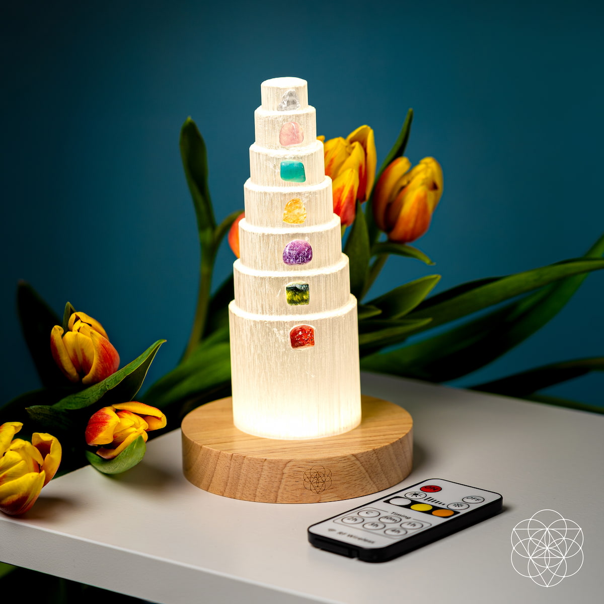Crystal lamp with seven different colored stones glowing on a wooden base — view 6