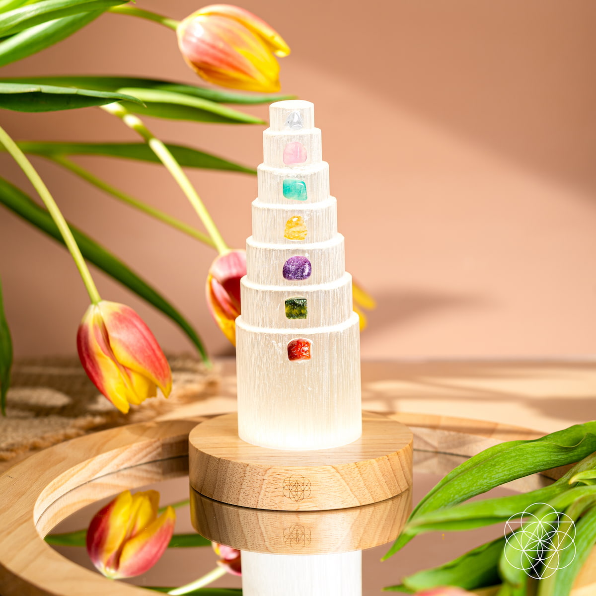 Crystal lamp with seven different colored stones glowing on a wooden base — view 5