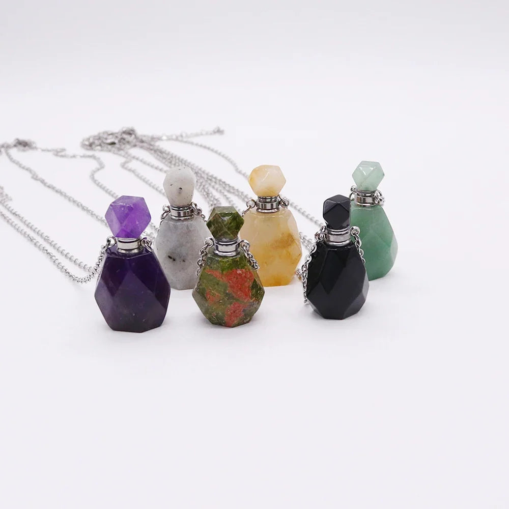 Small glass potion bottle pendant filled with crystals on a stainless steel chain — view 1 of 12