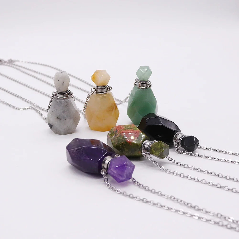 Small glass potion bottle pendant filled with crystals on a stainless steel chain — view 3 of 12