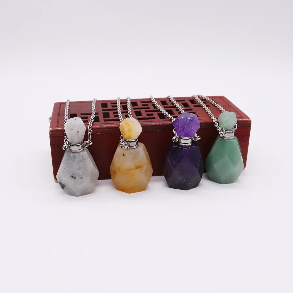 Small glass potion bottle pendant filled with crystals on a stainless steel chain — view 5 of 12