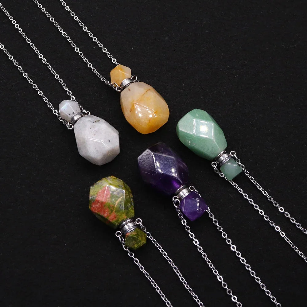 Small glass potion bottle pendant filled with crystals on a stainless steel chain — view 2 of 12