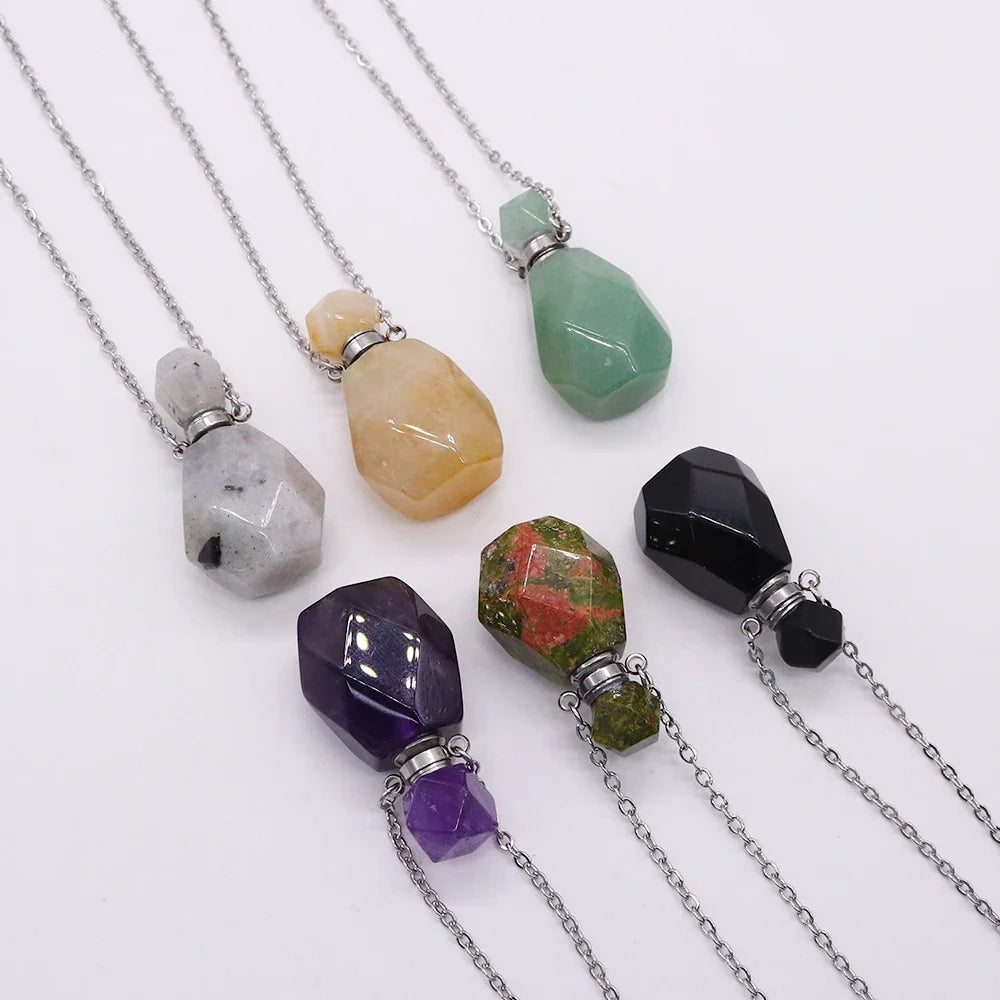 Small glass potion bottle pendant filled with crystals on a stainless steel chain — view 4 of 12