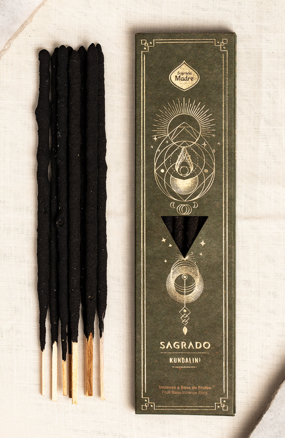 Kundalini incense sticks standing beside the closed Sagrado box