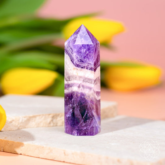 Chevron Amethyst crystal point with purple and white V-shaped bands