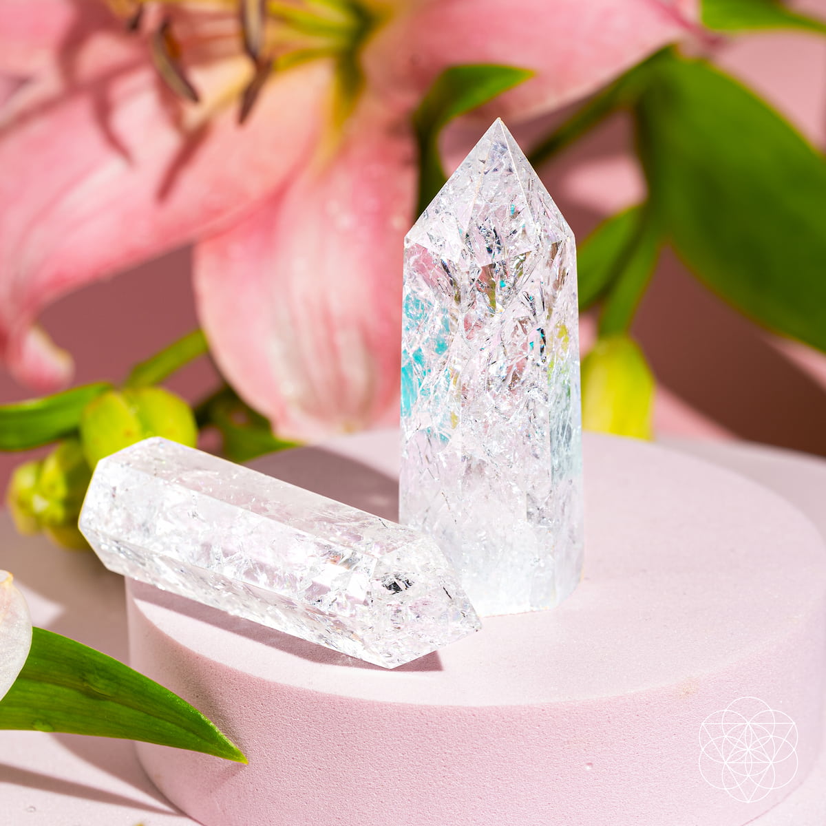 Ice Quartz crystal point with fractured internal prisms catching the light — view 2