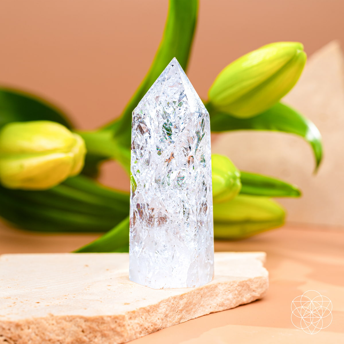 Ice Quartz crystal point with fractured internal prisms catching the light — view 3