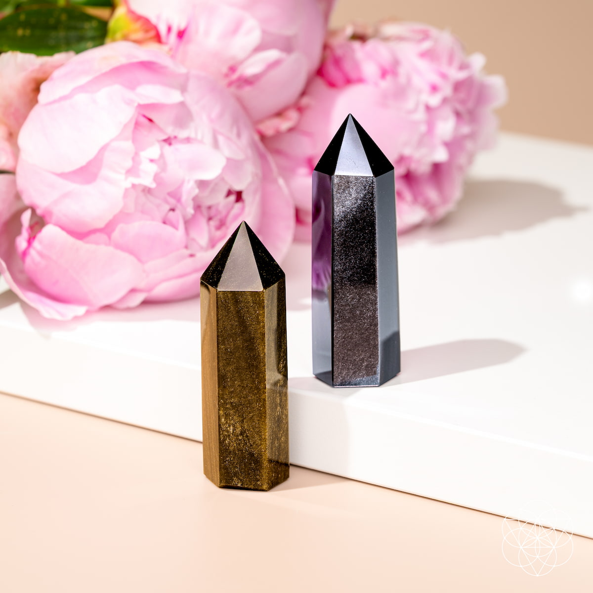 Gold Sheen and Silver Sheen Obsidian crystal points catching the light