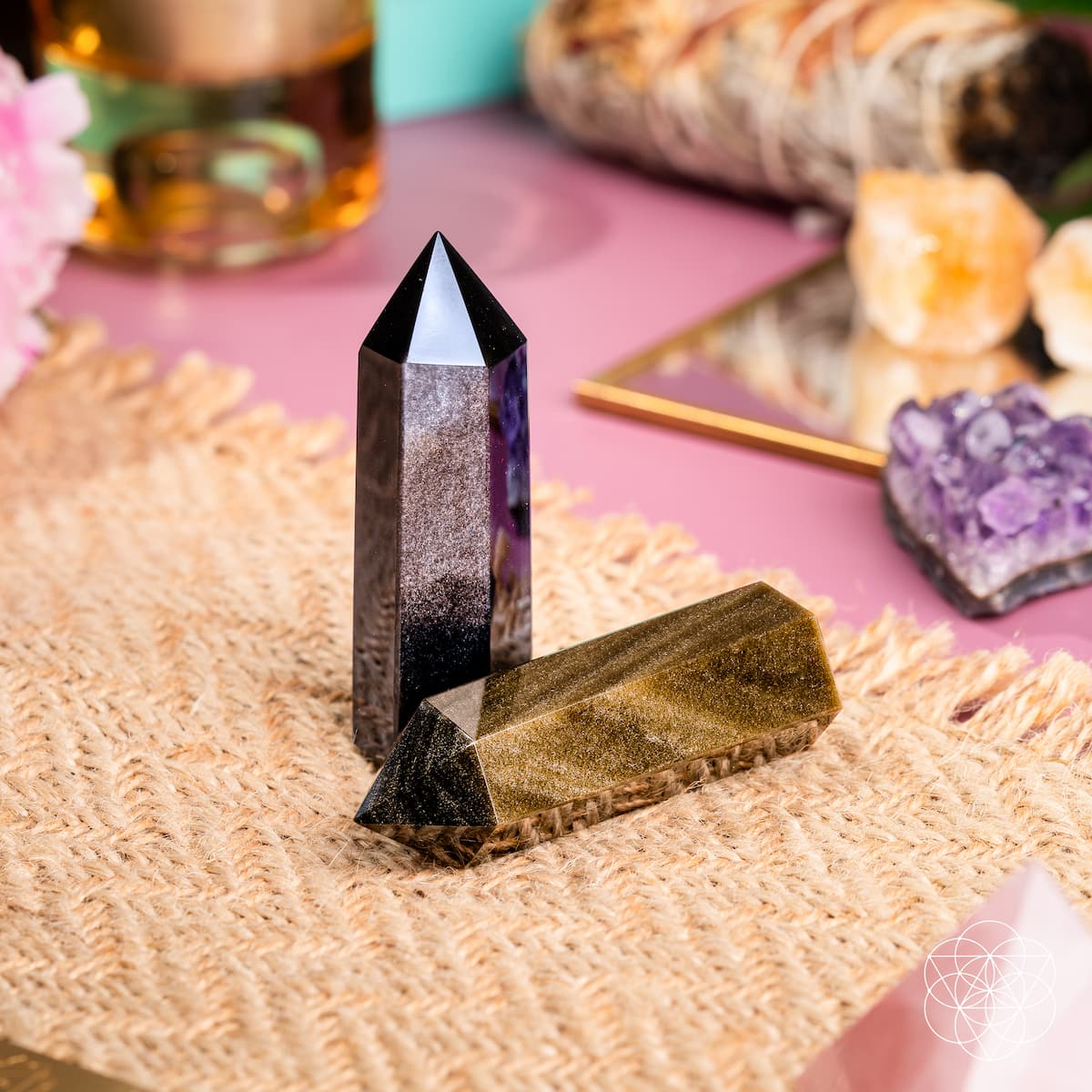 Gold Sheen and Silver Sheen Obsidian crystal points catching the light — view 4