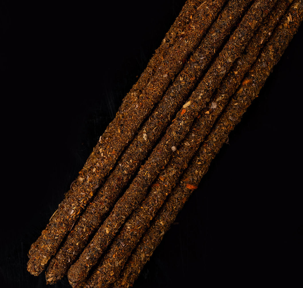Saturn Cosmos sticks lined up on a dark surface
