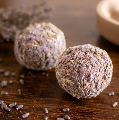 Close-up of two lavender herb smudge bombs