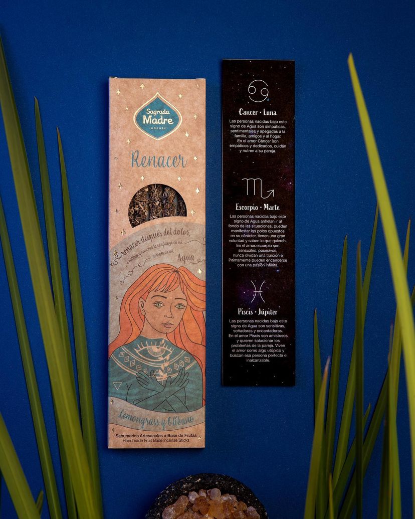 Renacer Water incense pack on a blue background with green reeds