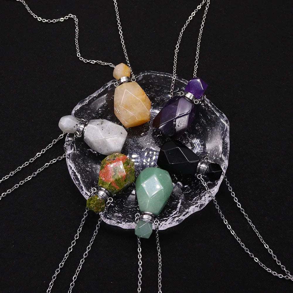 Small glass potion bottle pendant filled with crystals on a stainless steel chain — view 9 of 12