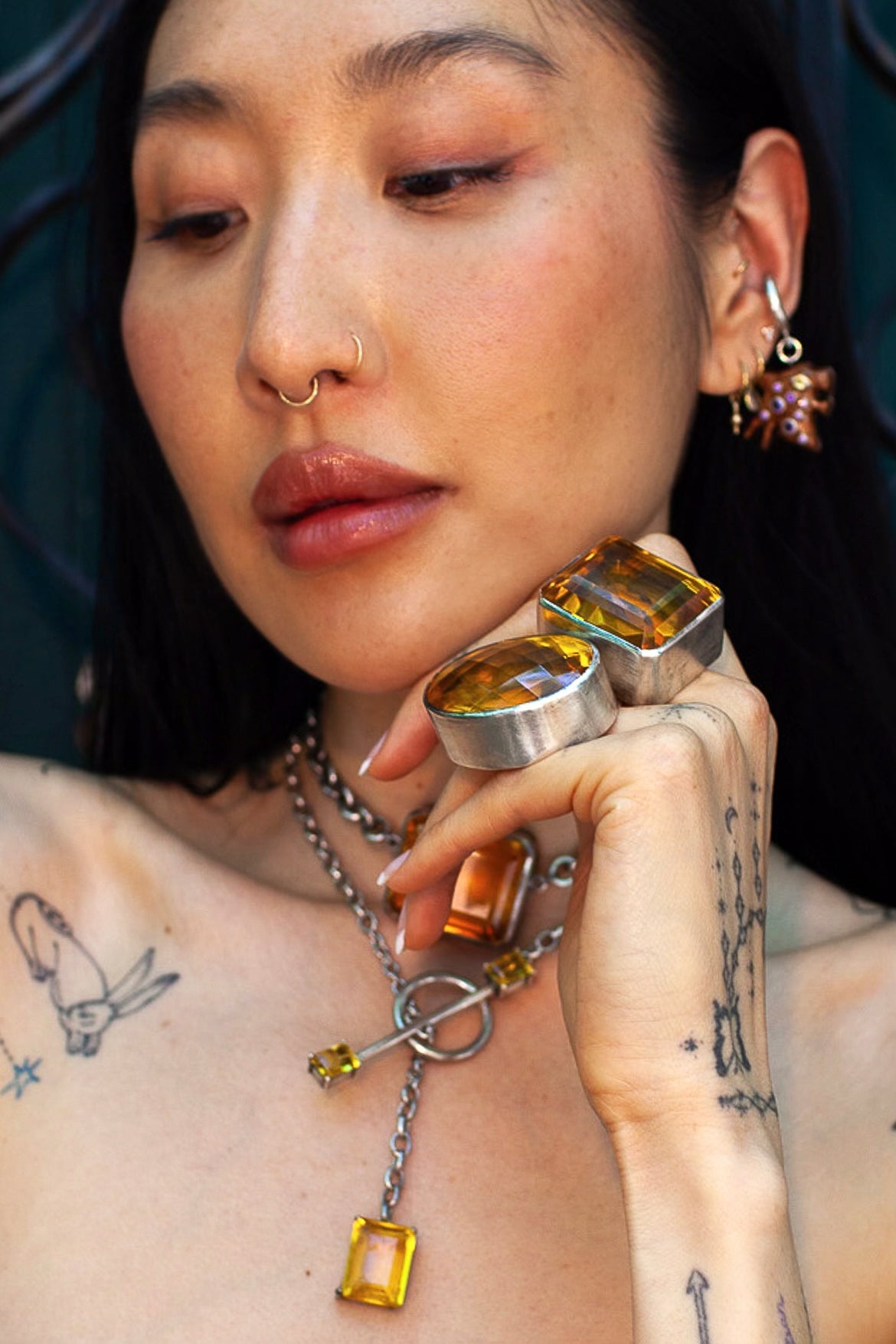 Oval Colossus Ring in Golden — oversized faceted golden yellow glass oval in a tall setting on a thick oxidized silver band — view 3