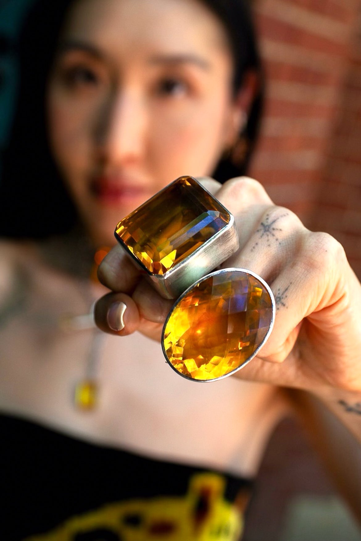 Oval Colossus Ring in Golden — oversized faceted golden yellow glass oval in a tall setting on a thick oxidized silver band