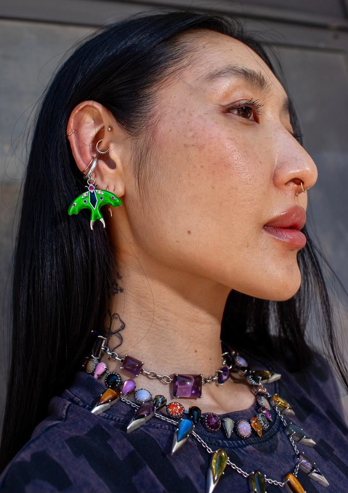 Luna moth ear cuff shown from the front