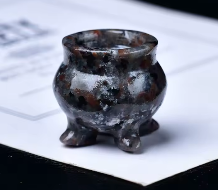 Small carved crystal cauldron with two handles, shown as an altar piece and crystal sphere stand — product photo 6