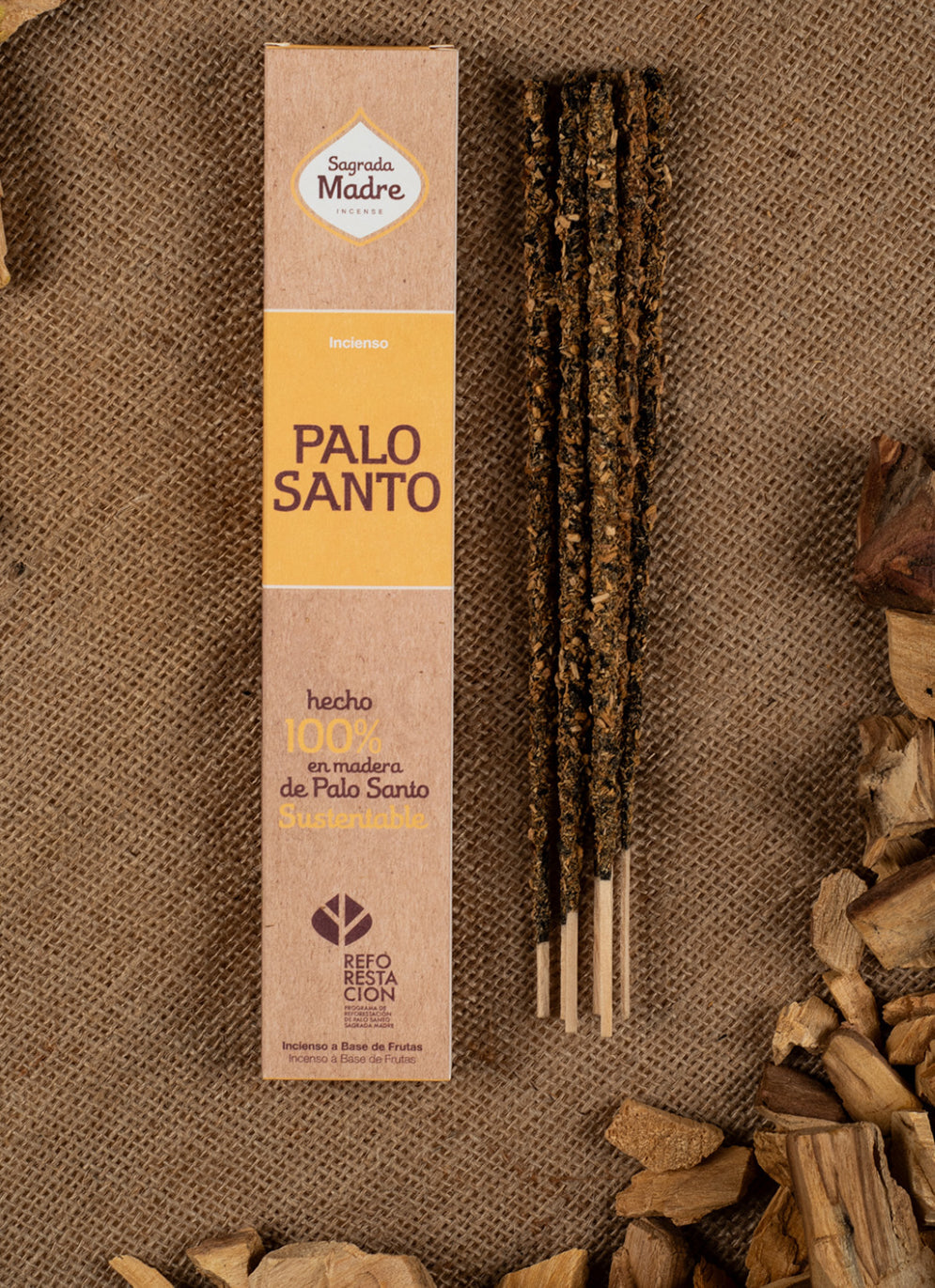 Plain Palo Santo incense pack on burlap surrounded by palo santo wood chips