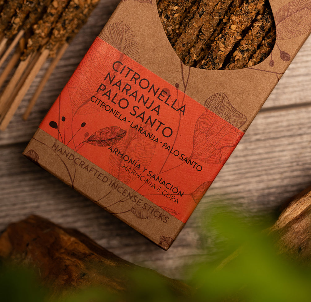 Citronella Palo Santo incense in its kraft Artesano box with green leaves