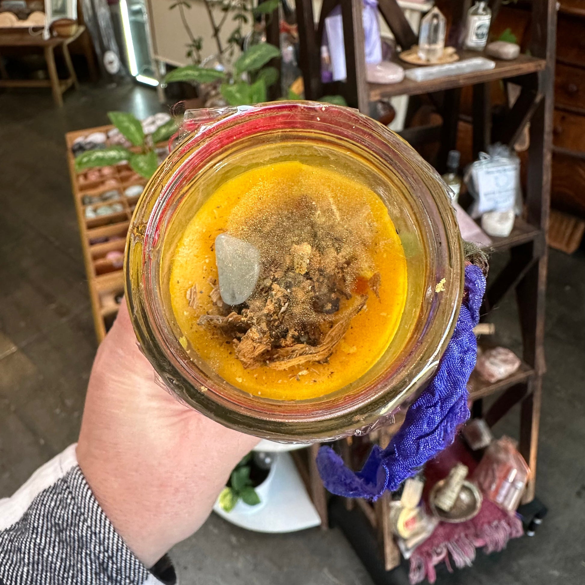 The Crown of Success seven-day candle standing on a heat-proof surface.