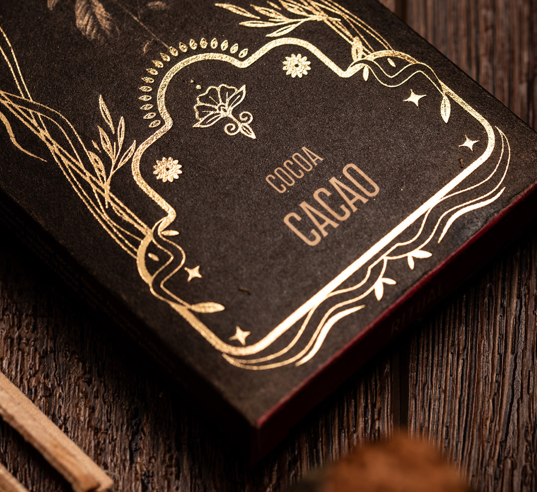 Cocoa Cacao lettering printed in gold on the black Ritual box