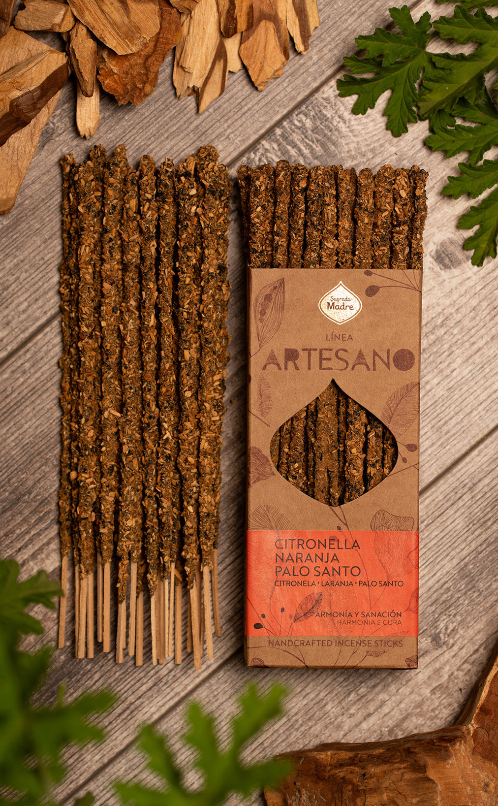 The Artesano box open with the hand-rolled citronella palo santo sticks visible