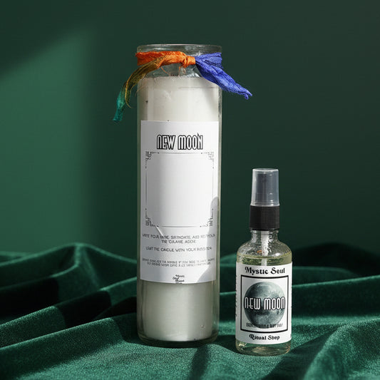 The New Moon seven-day candle showing rainbow moonstone set into the dressed wax.