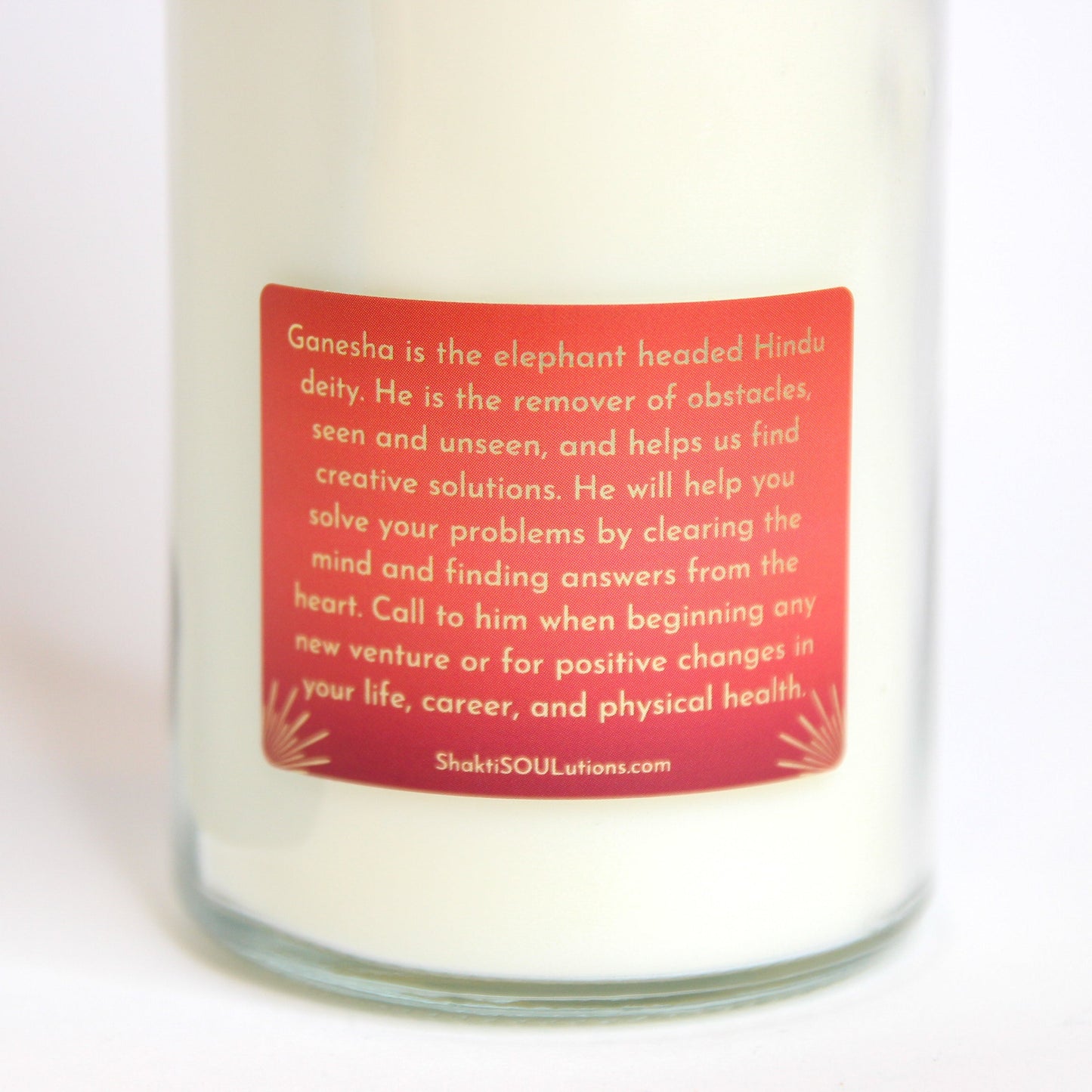 Ganesha Crystal Altar Candle in a 16 oz glass tumbler with an image of Ganesha on the label and crystals set into the wax — product photo 5