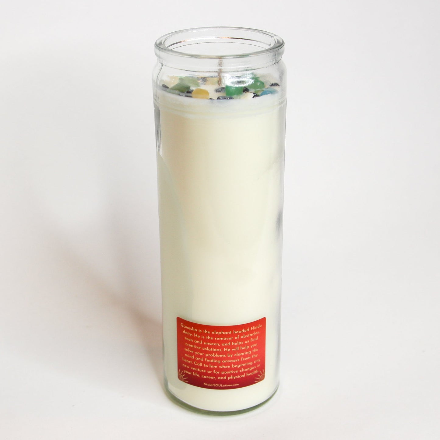 Ganesha Crystal Altar Candle in a 16 oz glass tumbler with an image of Ganesha on the label and crystals set into the wax — product photo 4
