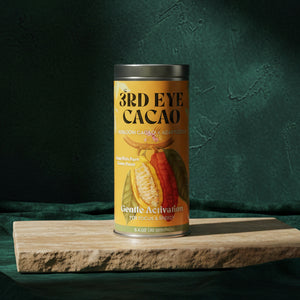 3rd Eye Cacao Gentle Activation tin, 8.4 oz, on a wooden board against a dark green backdrop