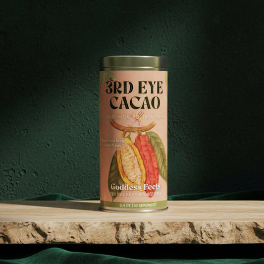 3rd Eye Cacao Goddess Feels tin, 8.4 oz, on a stone slab against a dark green backdrop