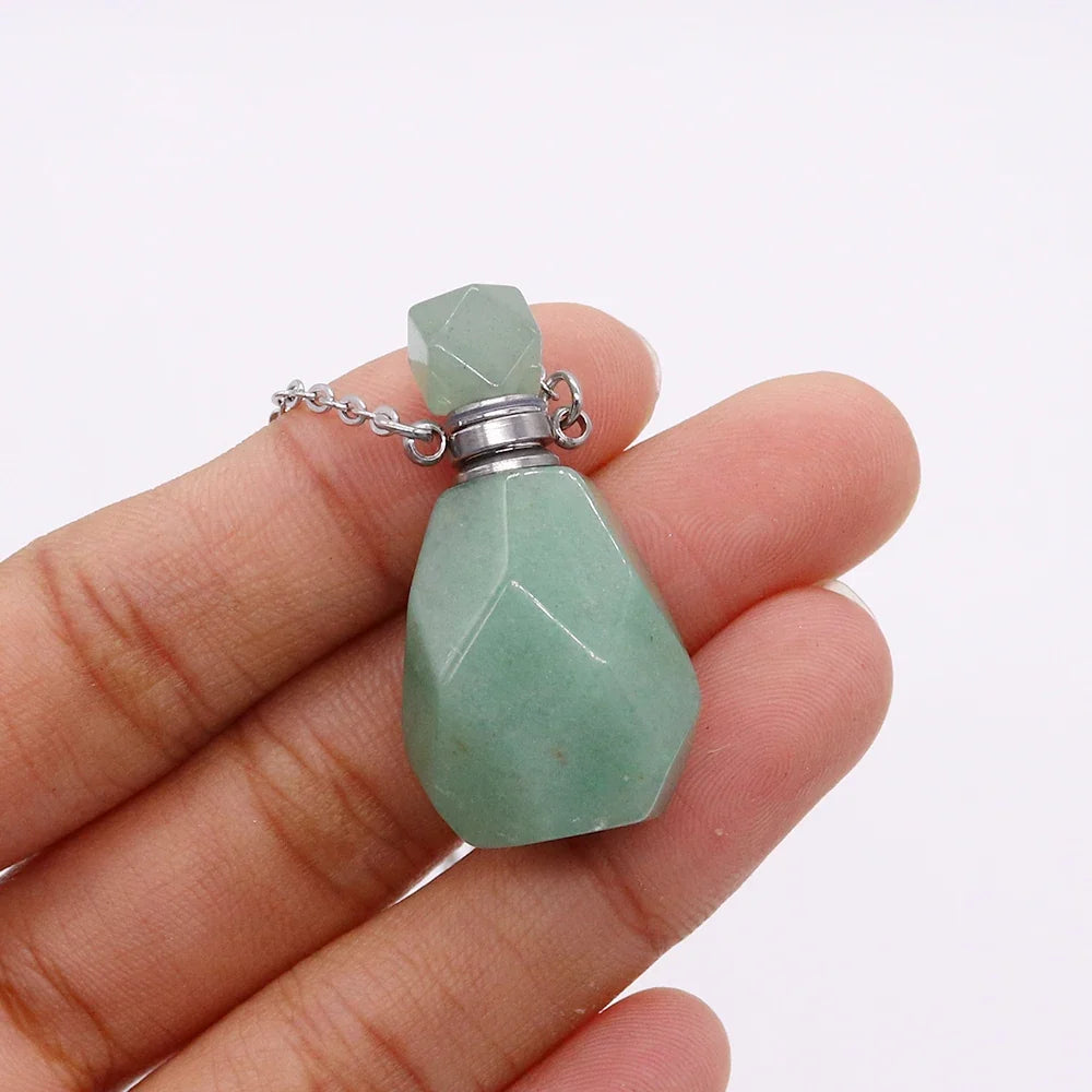 Small glass potion bottle pendant filled with crystals on a stainless steel chain — view 7 of 12