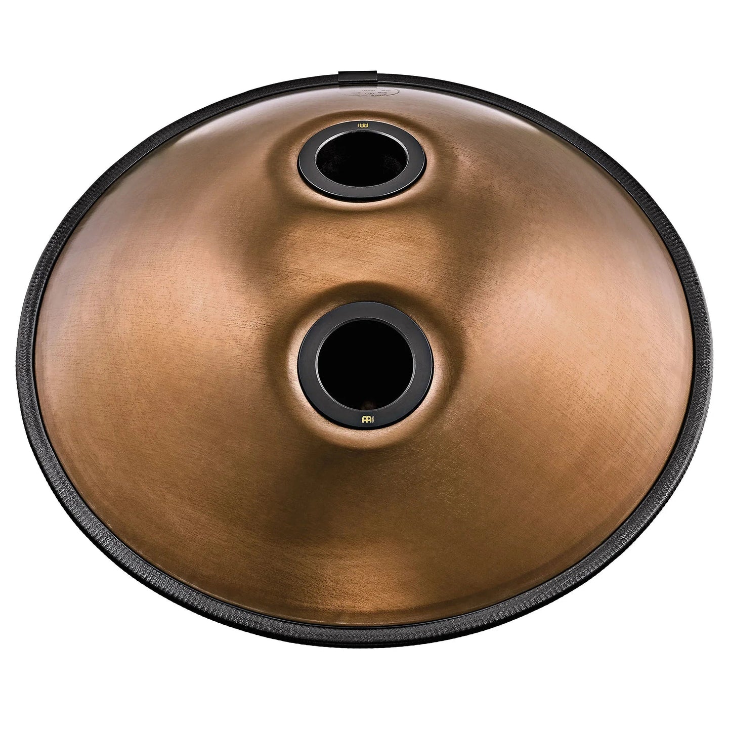 Vintage copper Sensory handpan with engraved design shown in a warm, styled tabletop arrangement.