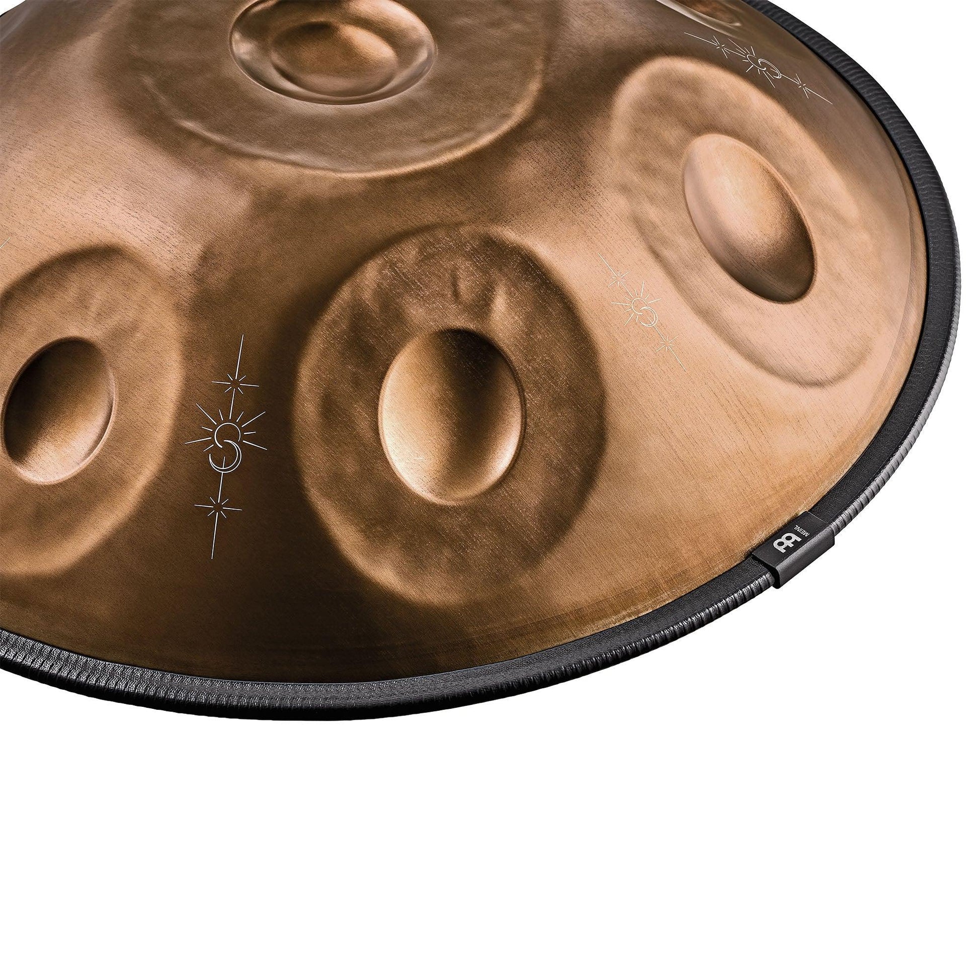 Vintage copper Sensory handpan with engraved design arranged in a softly lit lifestyle scene.