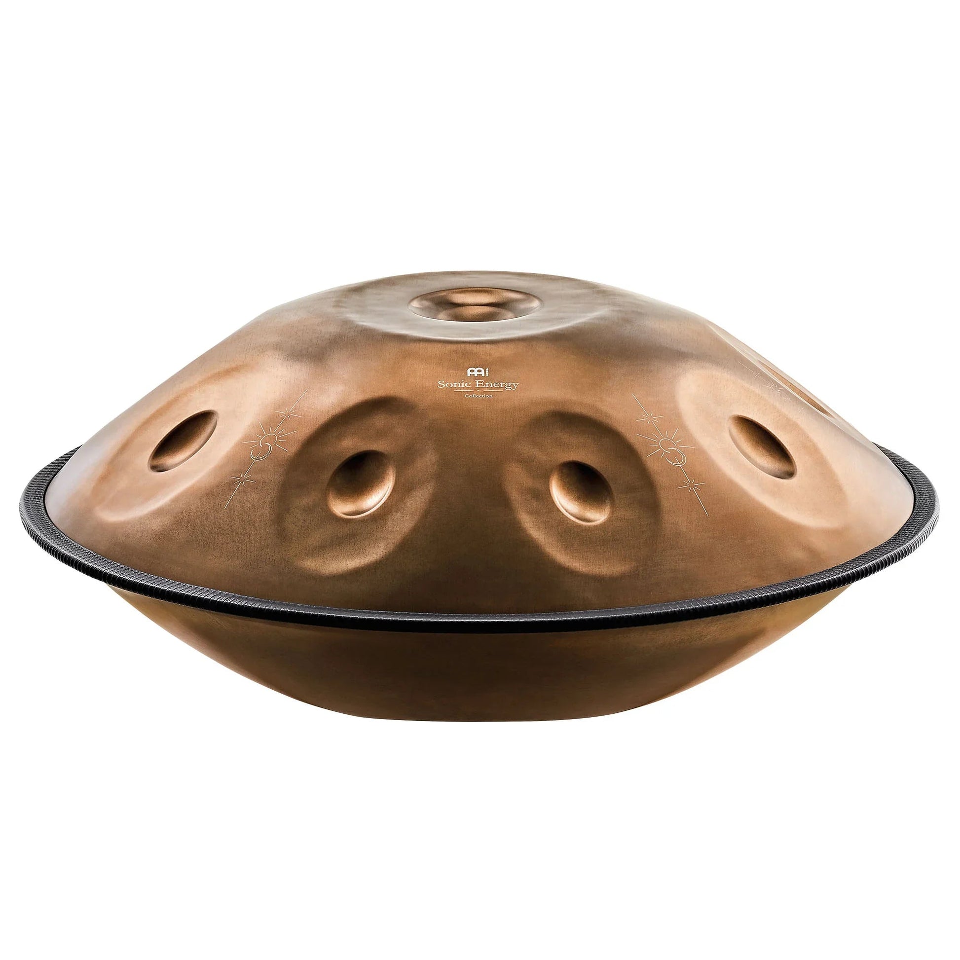 Vintage copper Sensory handpan with engraved design shown in a warm, softly lit styled scene.
