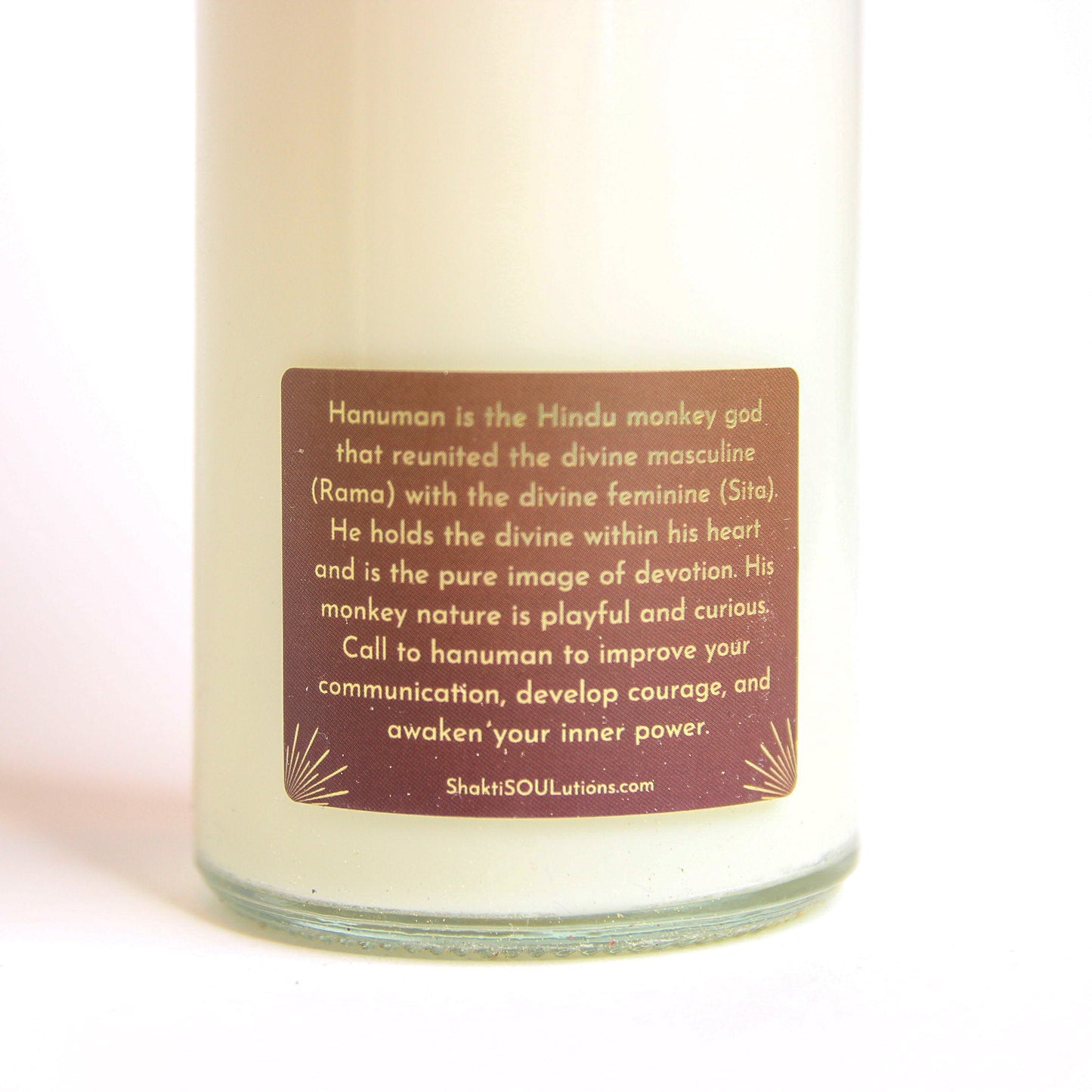 The Hanuman altar candle styled on a dark altar surface