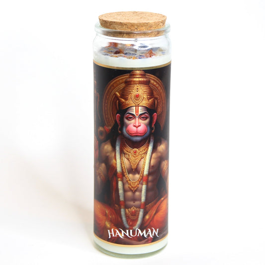 Hanuman crystal altar candle in a clear glass vessel, topped with crystals