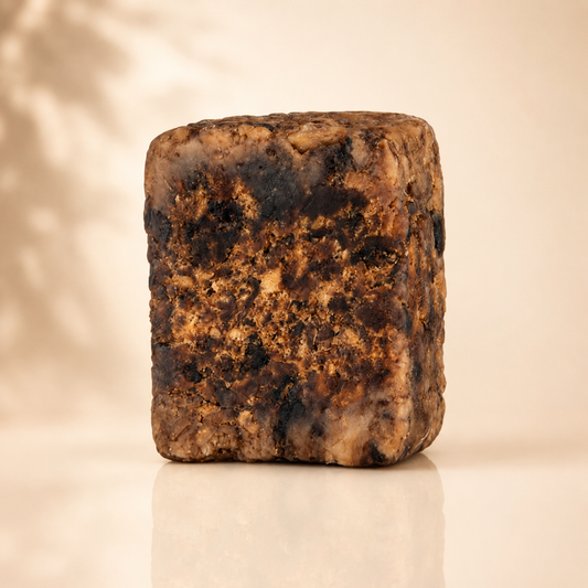Raw African black soap bar with a rough, natural surface