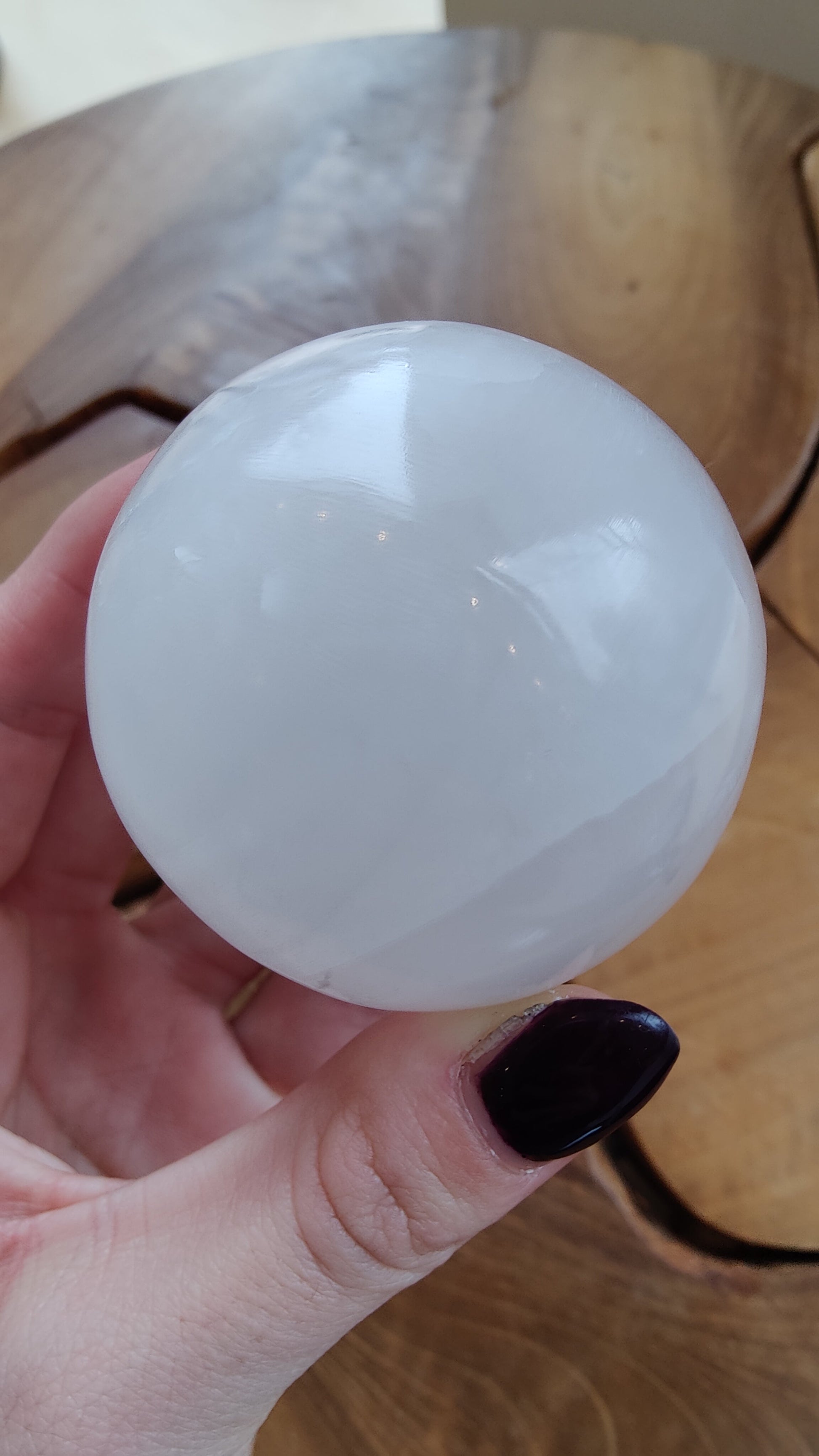 Selenite sphere showing the fibrous internal structure through the polish