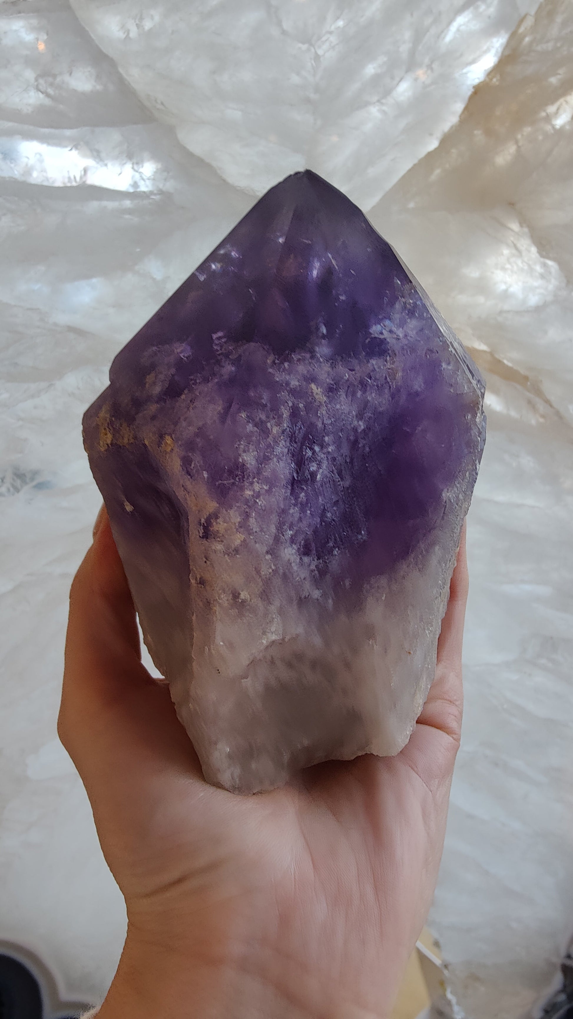 Bolivian amethyst point photographed from the side