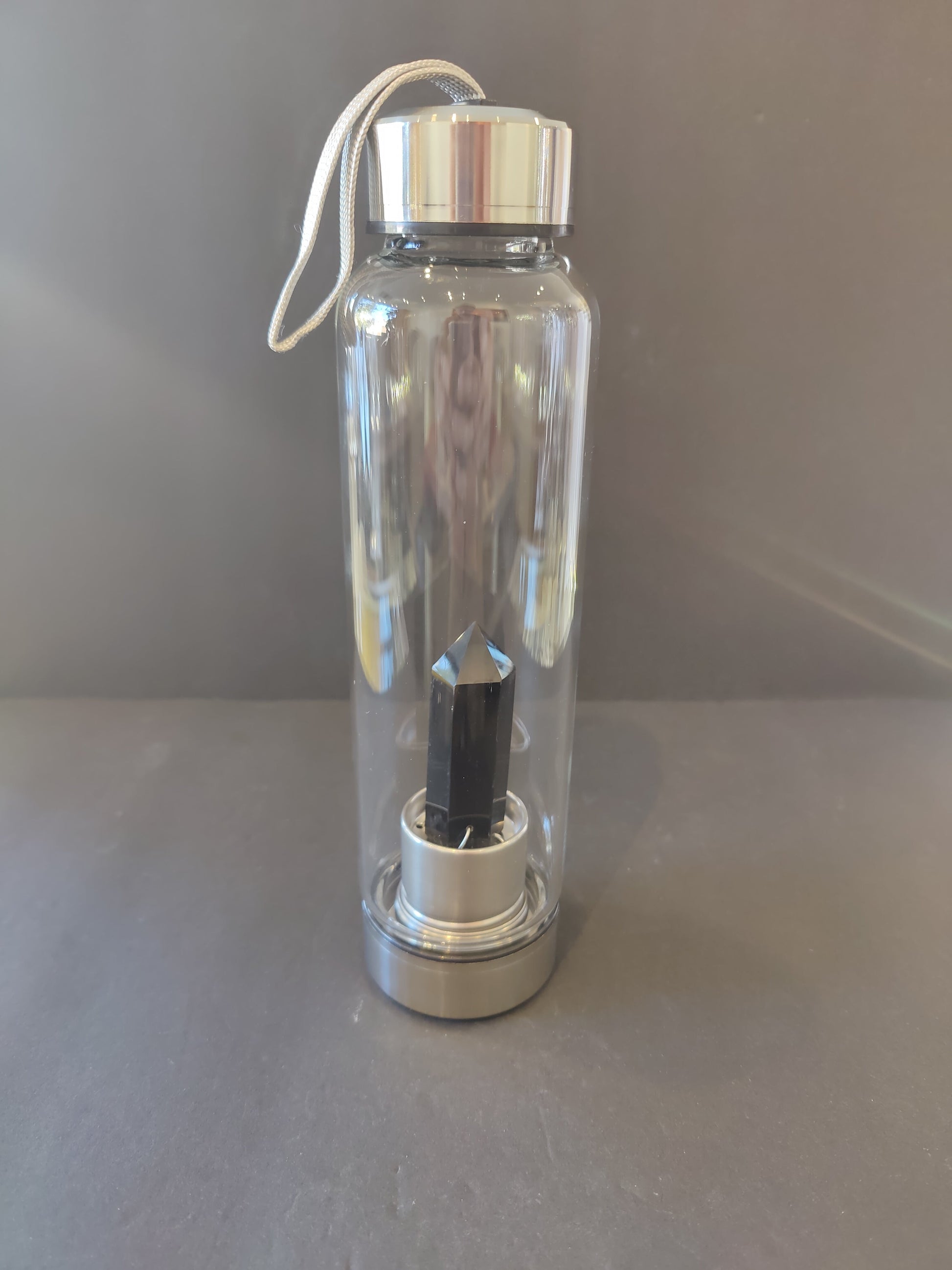 Sixteen-ounce crystal infused water bottle in stainless steel and glass with a fabric insulation sleeve and a crystal chamber in the base — view 6