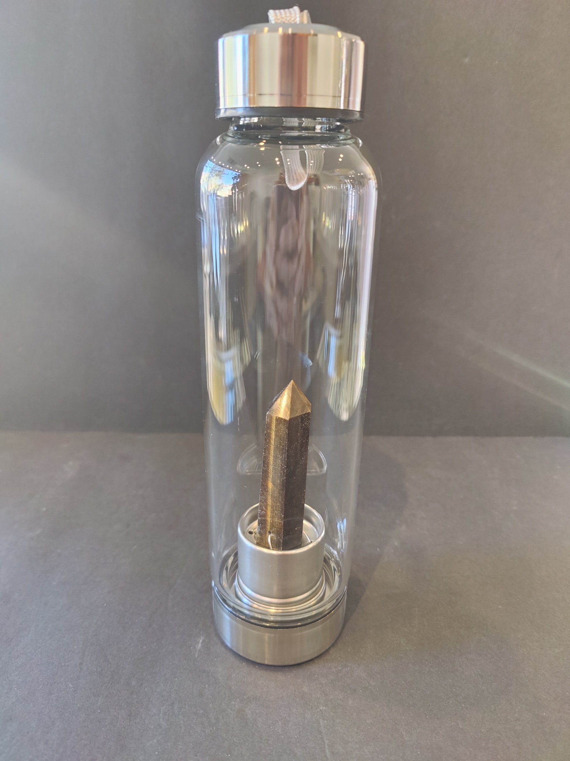 Sixteen-ounce crystal infused water bottle in stainless steel and glass with a fabric insulation sleeve and a crystal chamber in the base — view 7